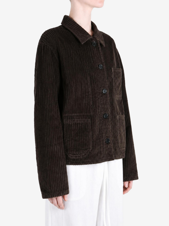 Brown jacket worn by a person, showing the jacket fit