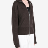 Brown knitwear worn by a person, showing the knitwear fit
