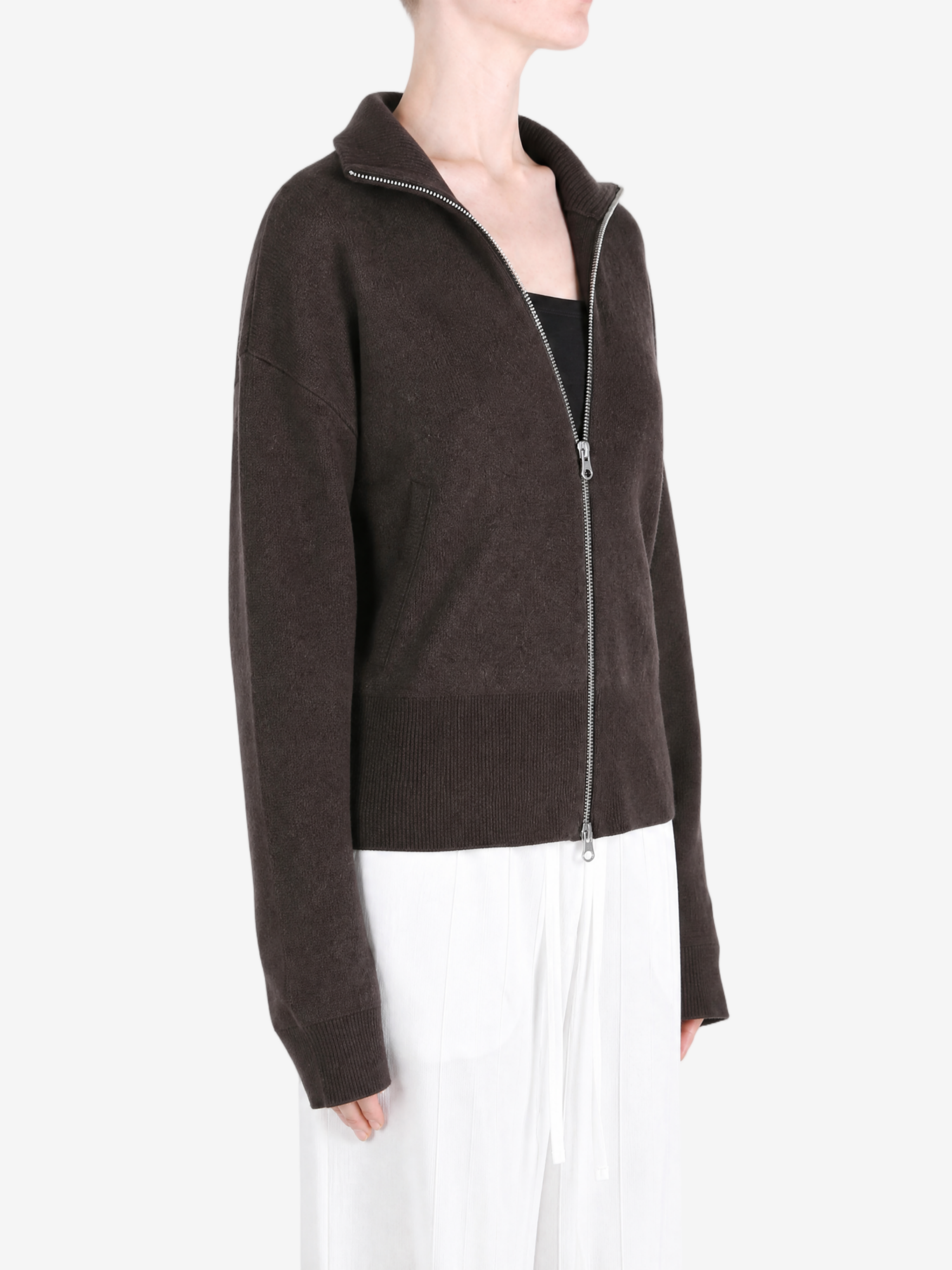 Brown knitwear worn by a person, showing the knitwear fit