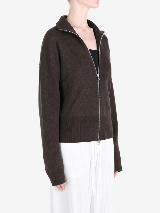 Brown knitwear worn by a person, showing the knitwear fit