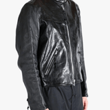 Black leather jacket worn by a person, showing the jacket fit