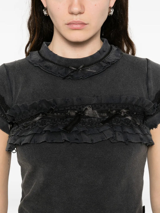 Close up of black t-shirts, showing texture of the fabric