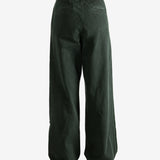 Green pants worn by a person, showing the pants's fit