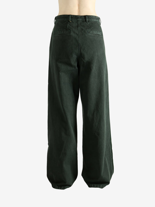 Green pants worn by a person, showing the pants's fit