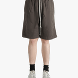 Brown shorts worn by a person, showing the shorts fit