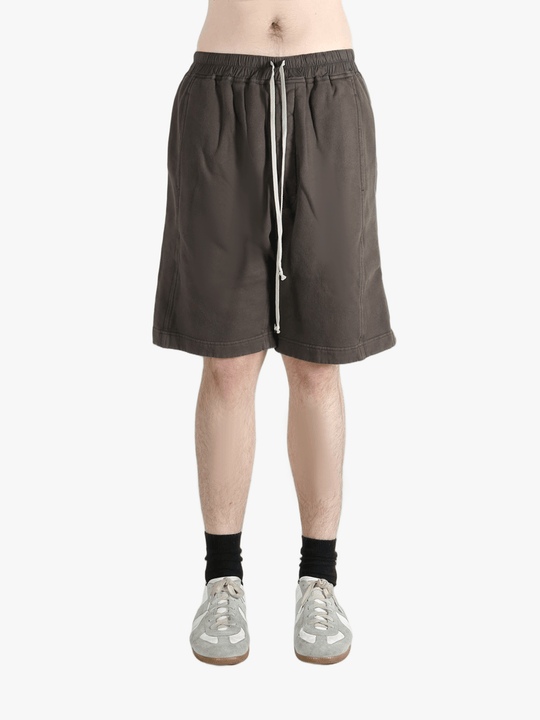 Brown shorts worn by a person, showing the shorts fit