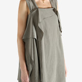 Grey tops worn by a person, showing the tops fit