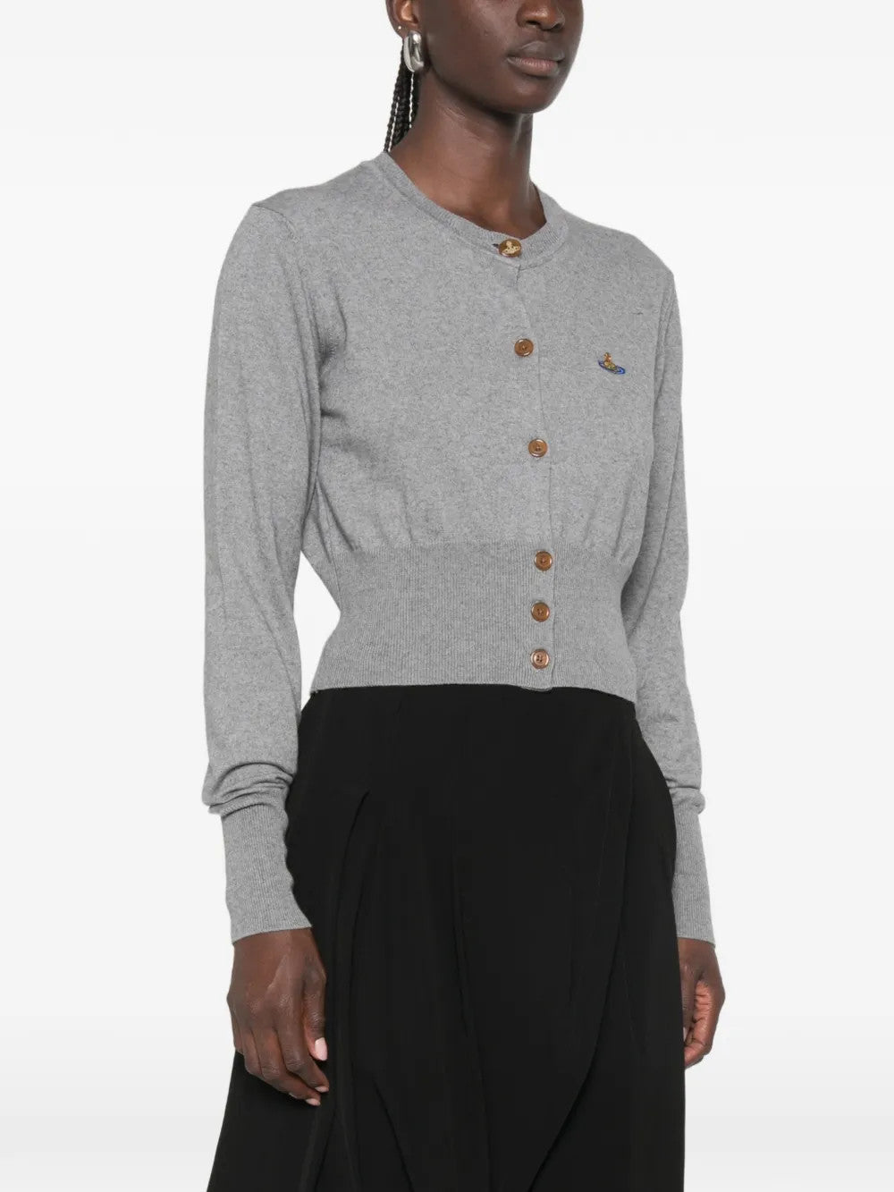 Grey knitwear worn by a person, showing the knitwear fit