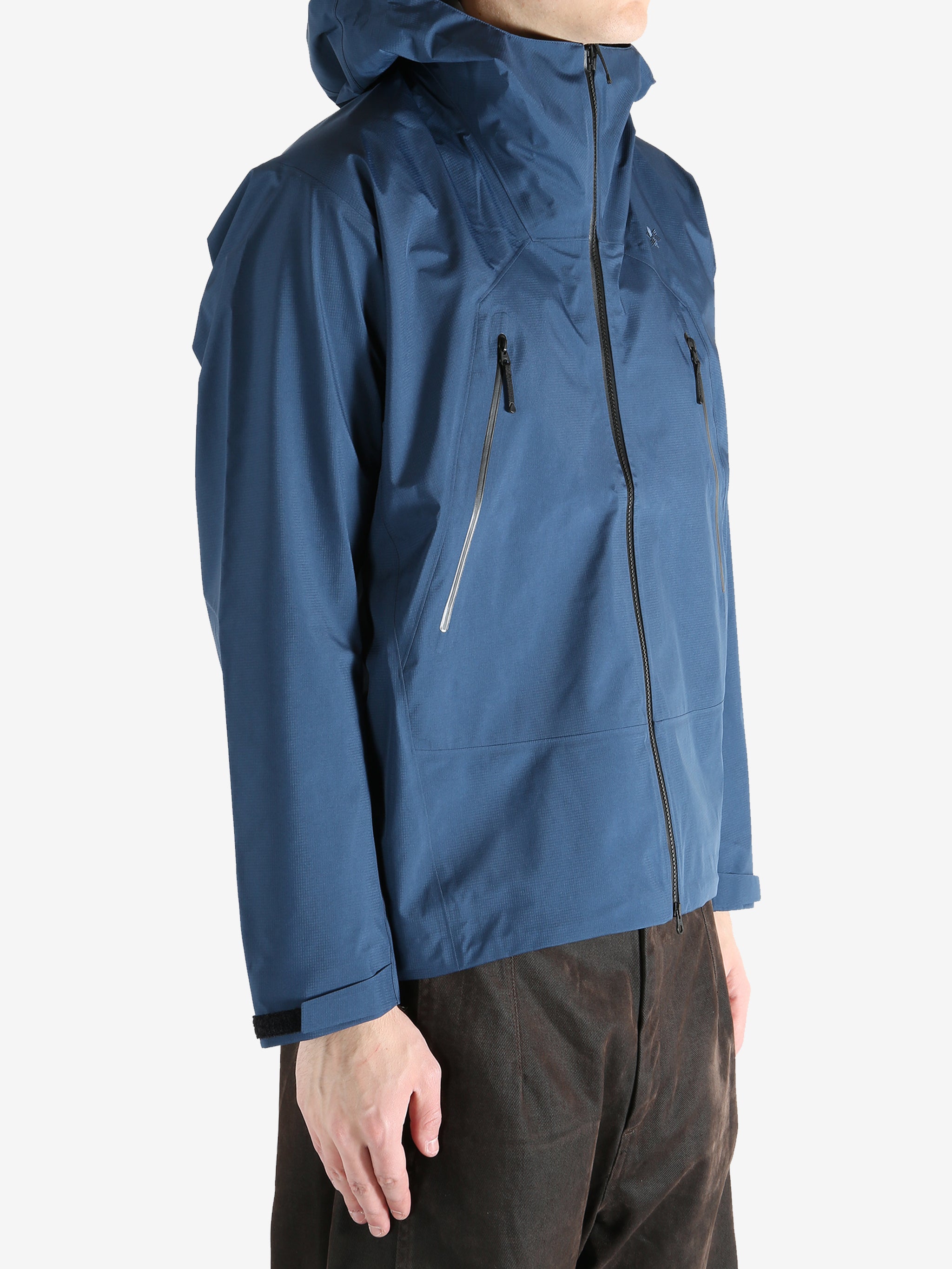 Navy jacket worn by a person, showing the jacket  fit