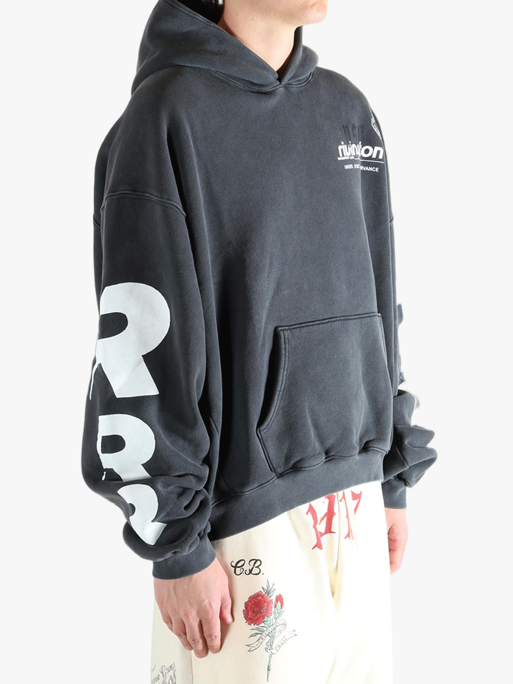 Black hoodie worn by a person, showing the hoodie fit