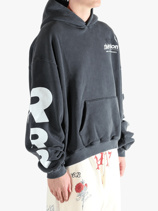 Black hoodie worn by a person, showing the hoodie fit