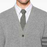 Close up of the grey knitwear, showing texture of the wool fabric