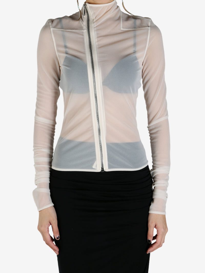 White coat worn by a person, showing the coat's fit