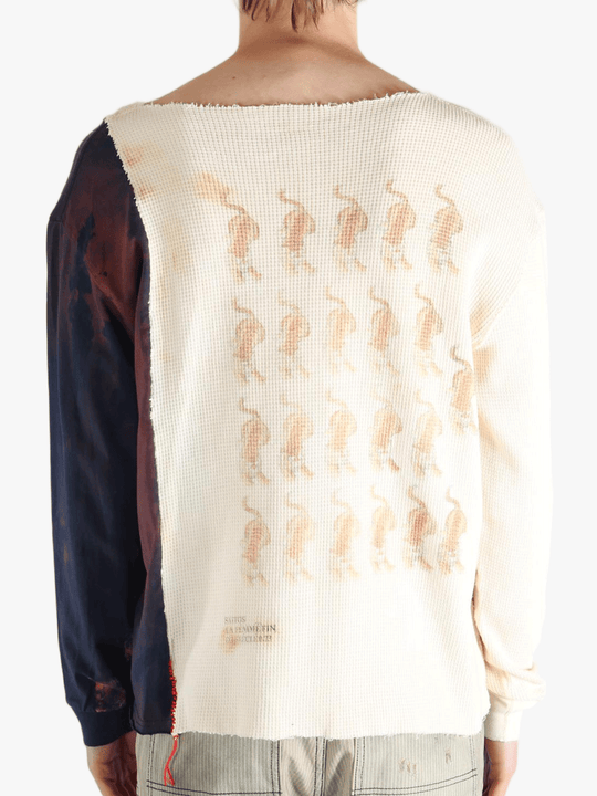 White knitwear worn by a person, showing the knitwear fit