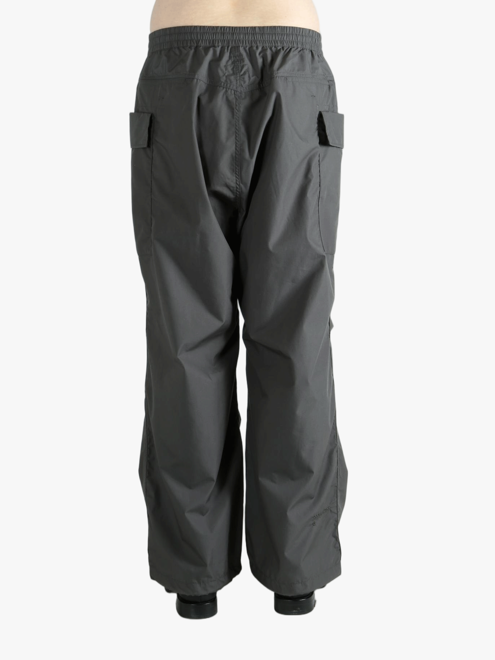 Grey pants worn by a person, showing the pants fit