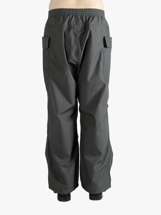 Grey pants worn by a person, showing the pants fit