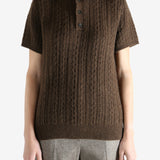 Brown knitwear worn by a person, showing the knitwear fit