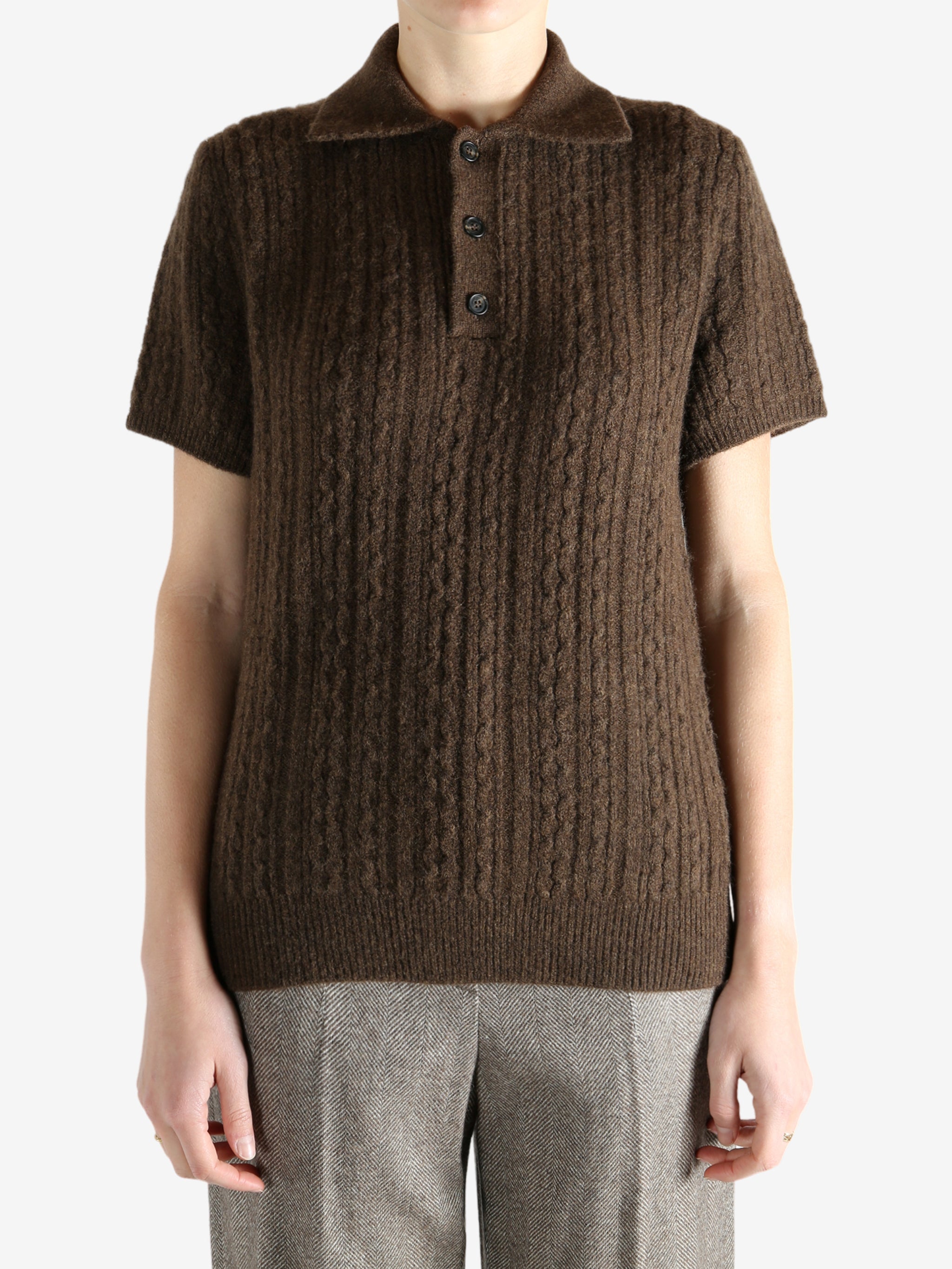 Brown knitwear worn by a person, showing the knitwear fit