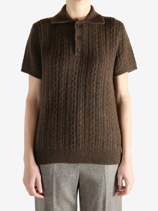 Brown knitwear worn by a person, showing the knitwear fit
