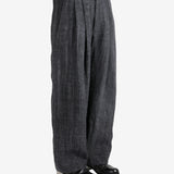 Black pants,worn by a person, showing the pants's fit