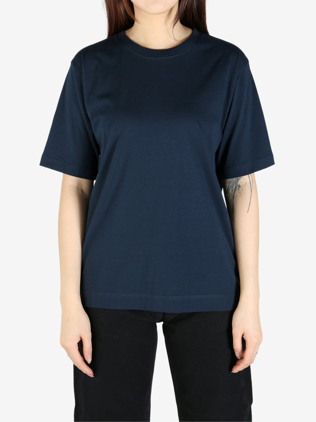 Navy tee worn by a person, showing the tee's fit