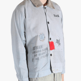 Grey jacket worn by a person, showing the jacket's fit
