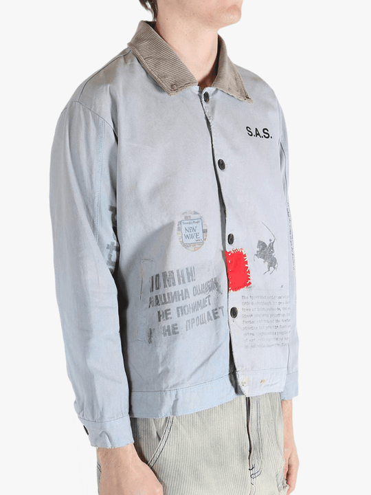 Grey jacket worn by a person, showing the jacket's fit