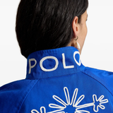 Blue jacket worn by a person, showing the jacket fit