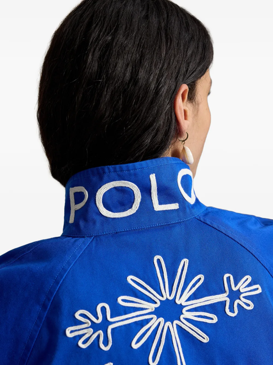 Blue jacket worn by a person, showing the jacket fit