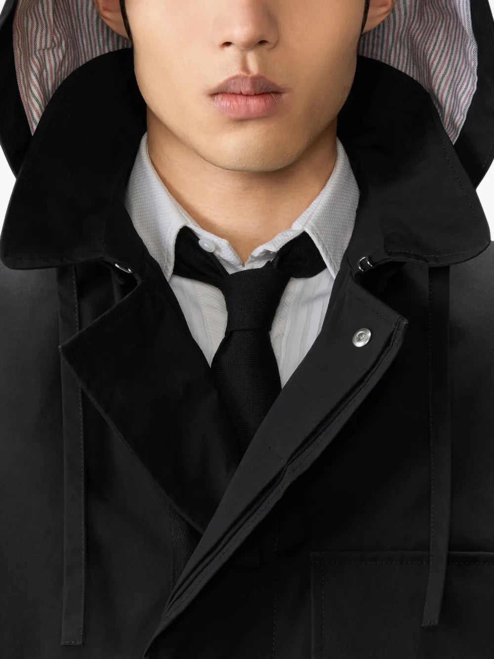 Black jacket worn by a person, showing the jacket fit