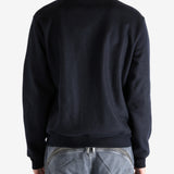 Navy coat worn by a person, showing the coat's fit