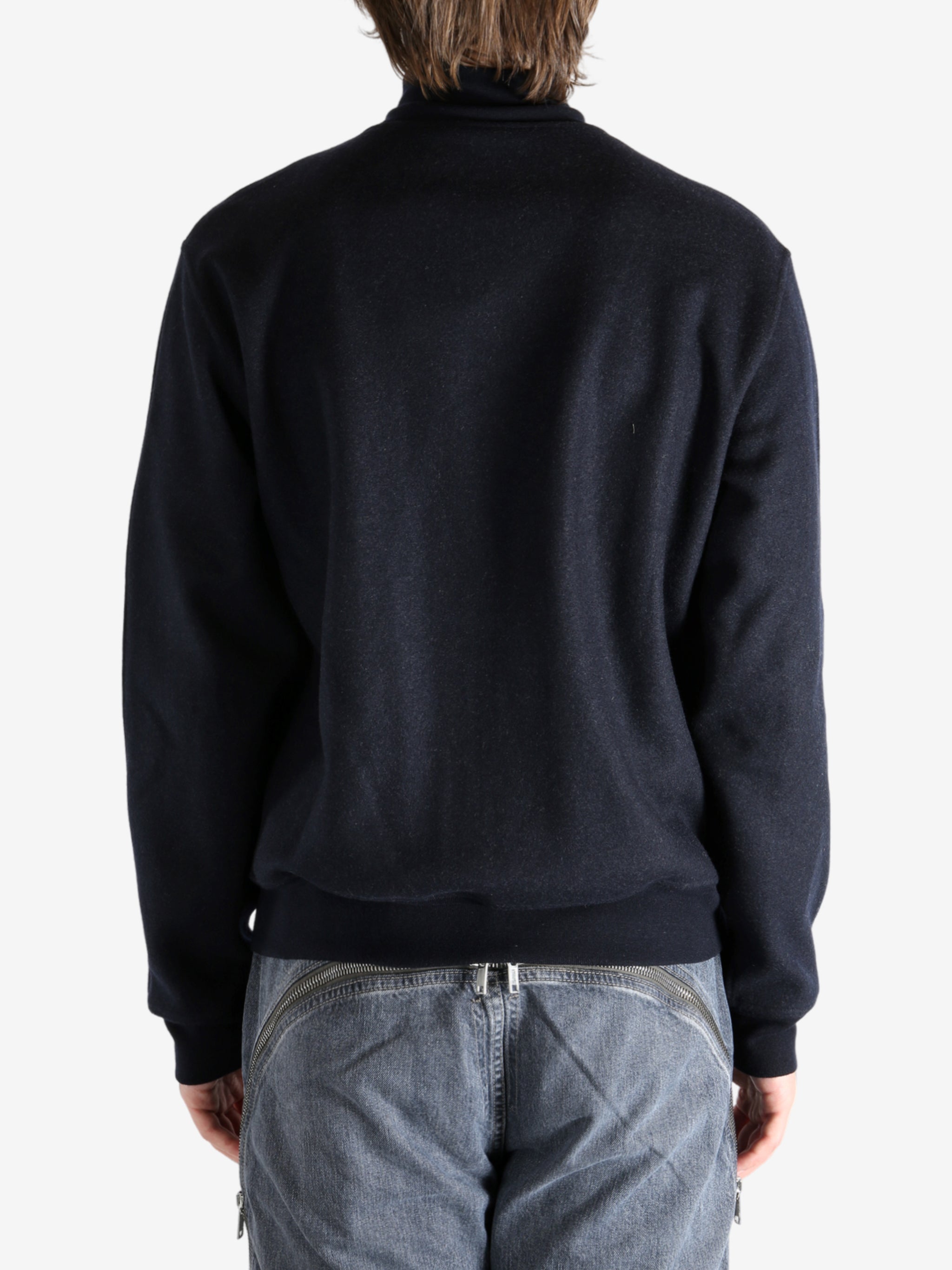 Navy coat worn by a person, showing the coat's fit