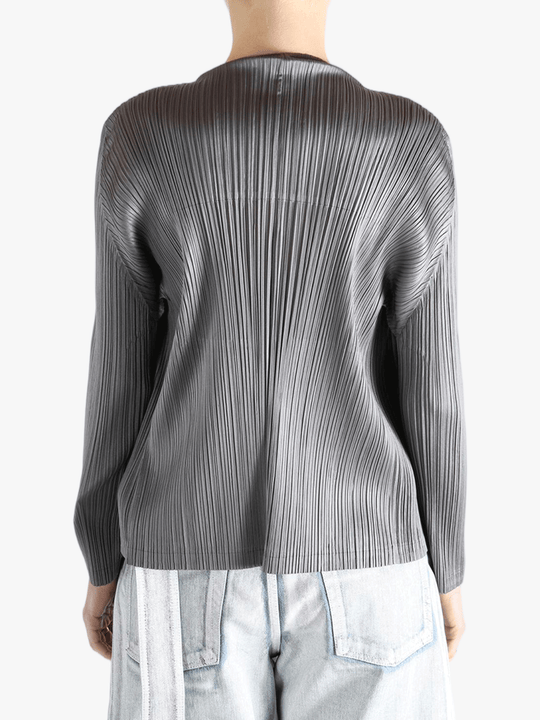 Grey cardigan worn by a person, showing the cardigan's fit