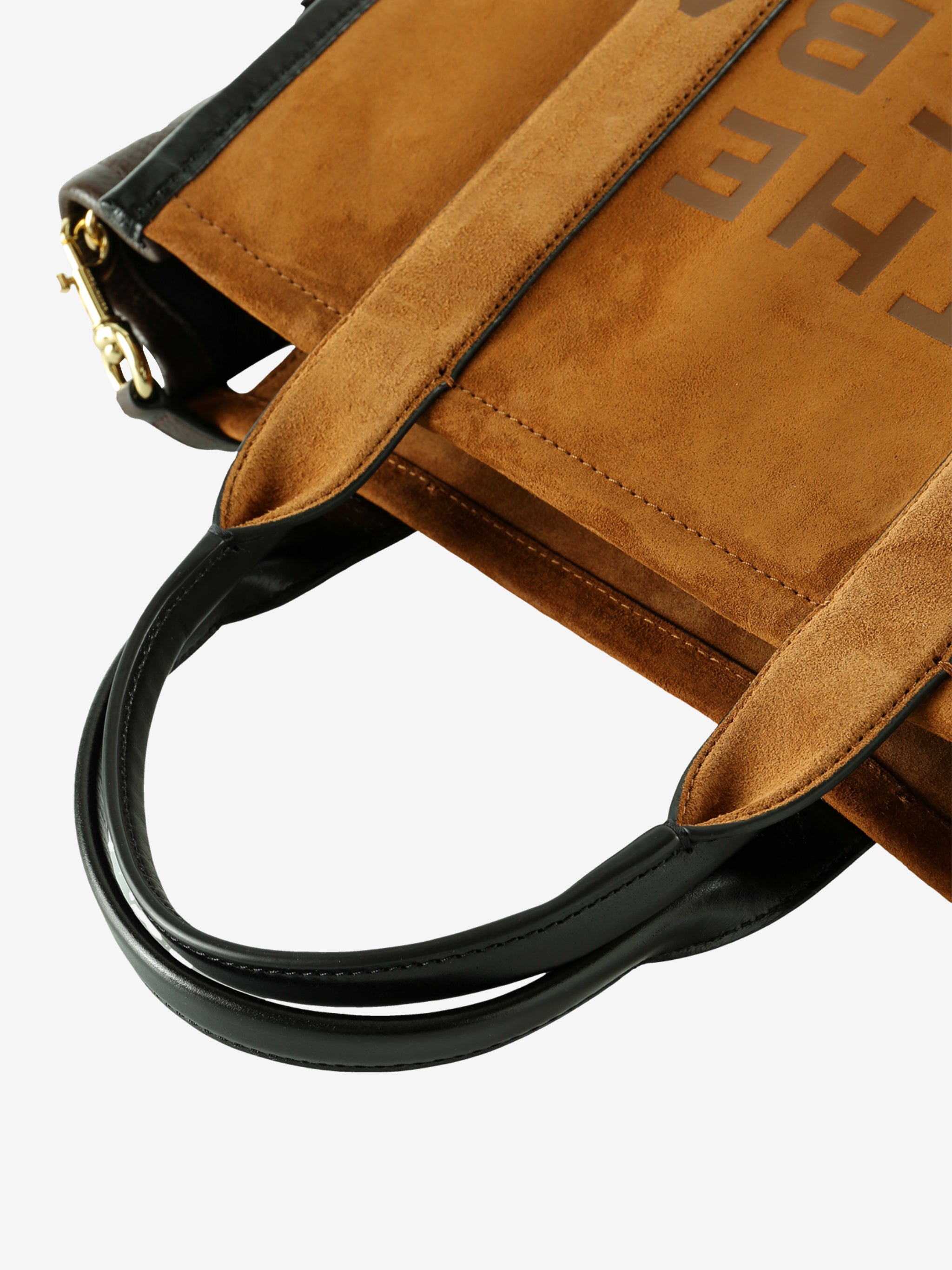 Close up of brown bag, showing texture of the leather fabric