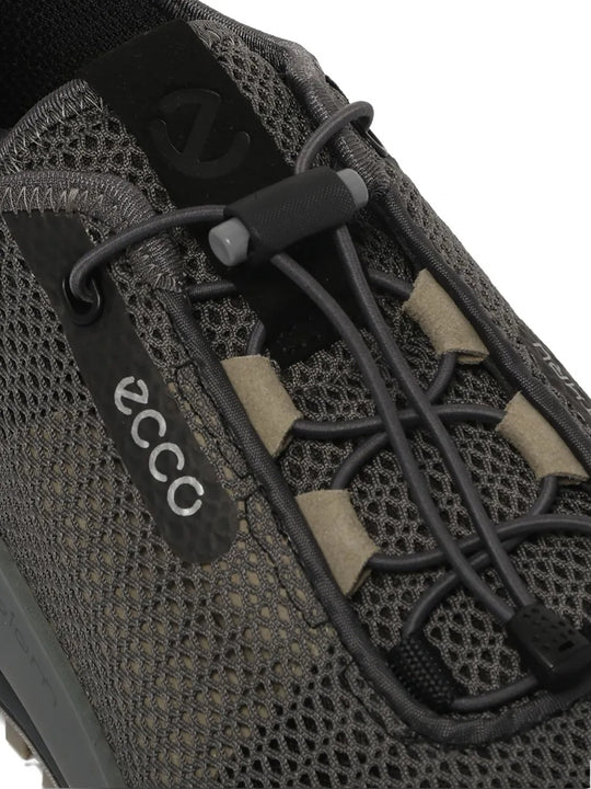 Cloes up of black sneakers, showing texture of the fabirc detail