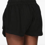 Black shorts worn by a person, showing the shorts fit