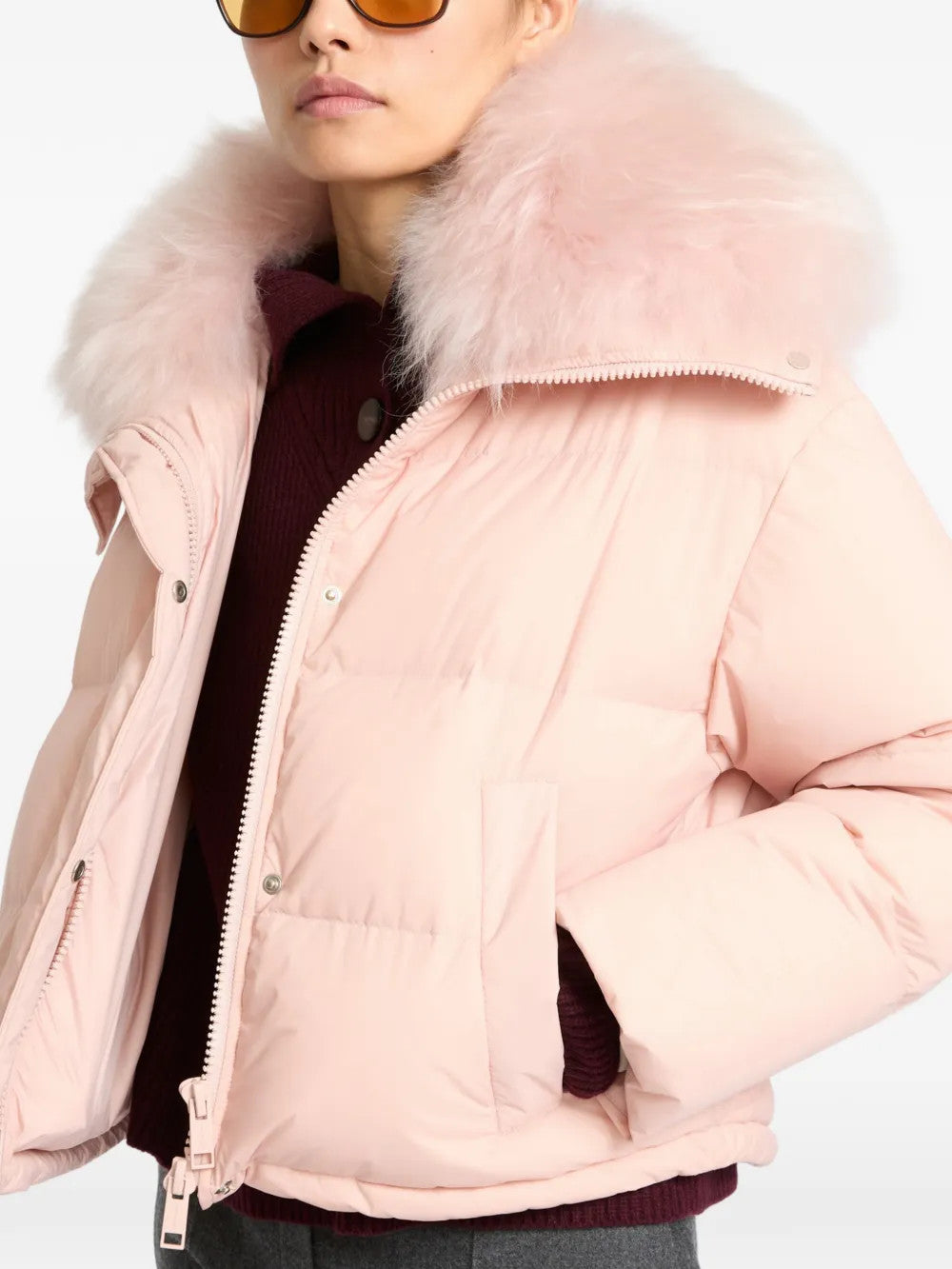 Pink jacket worn by a person, showing the jacket fit