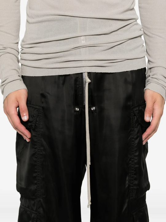 Close up of black pants, showing texture of the cotton fabric