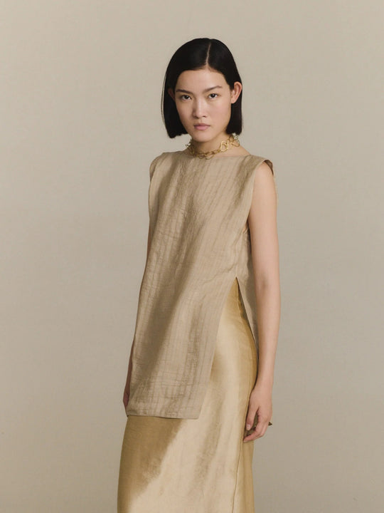 Tan top worn by a person, showing the top fit