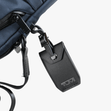 Close up of navy bag, showing texture of the nylon fabric