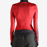 red jacket worn by a person, showing the jacket fit