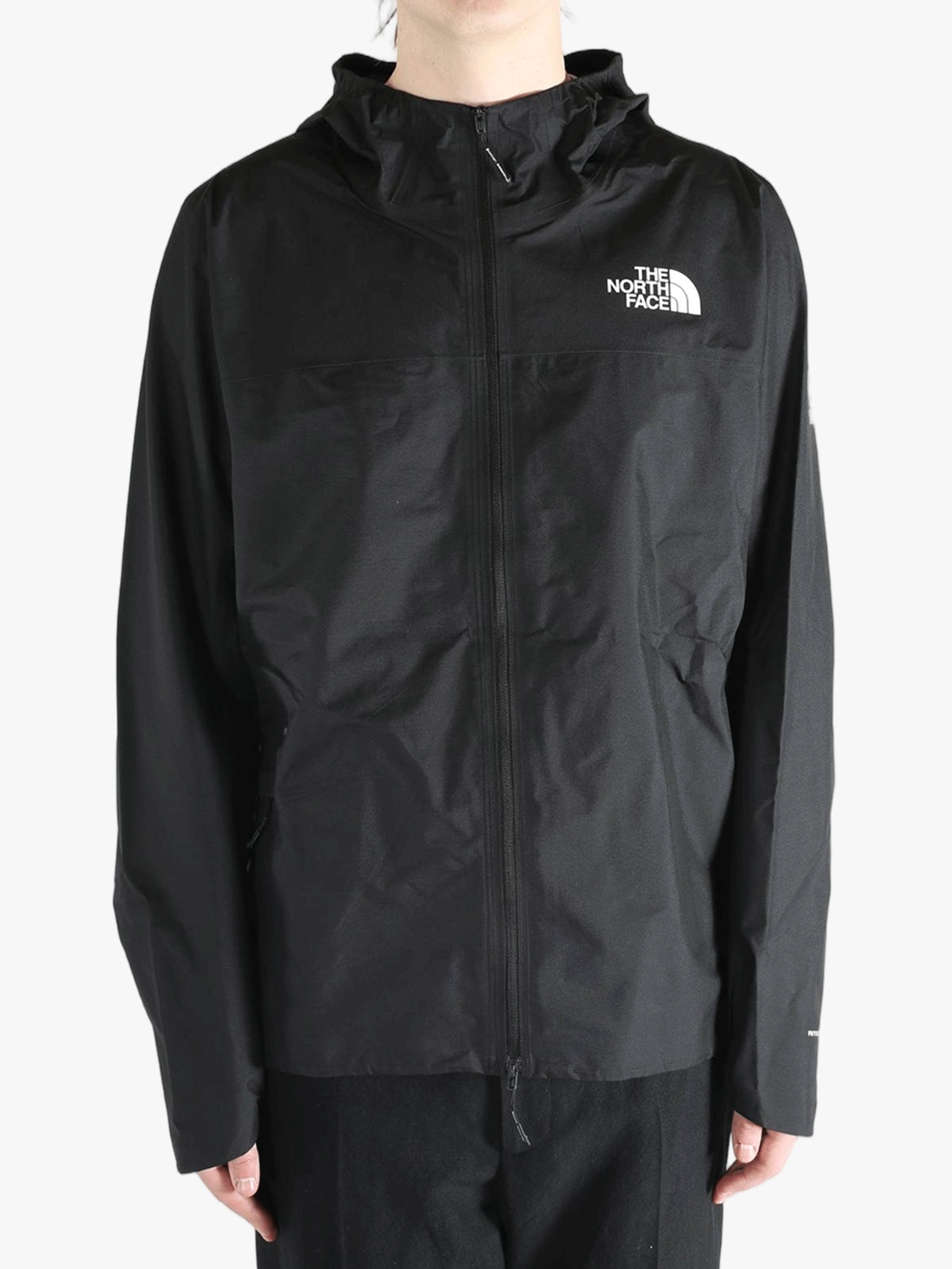 Black jacket worn by a person, showing the jacket's fit