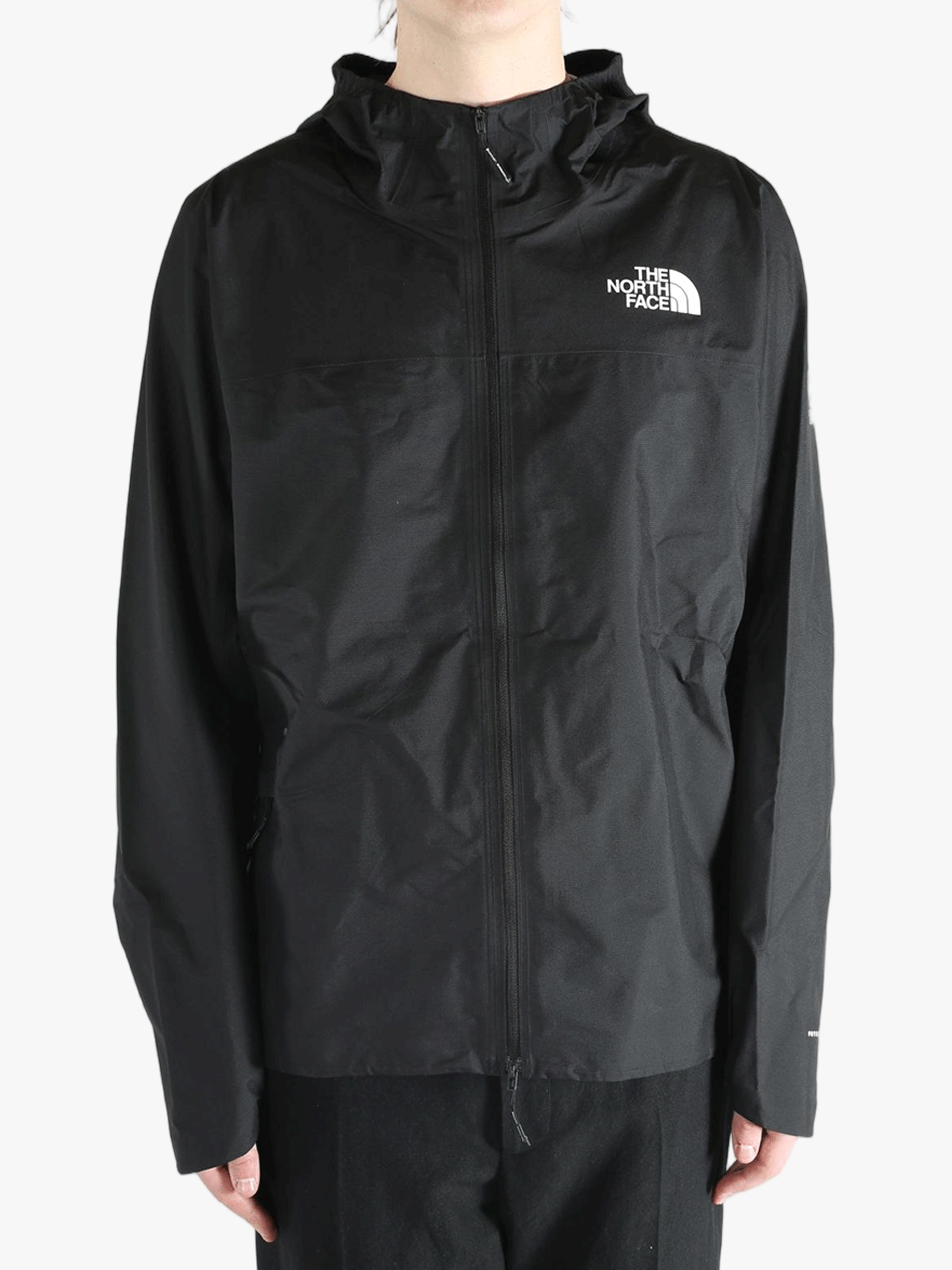 Black jacket worn by a person, showing the jacket's fit