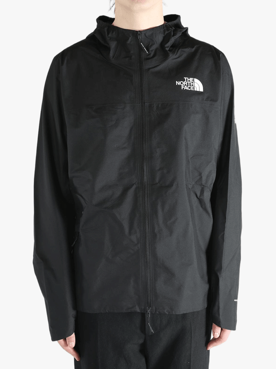 Black jacket worn by a person, showing the jacket's fit