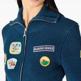 Blue jacket worn by a person, showing the jacket fit