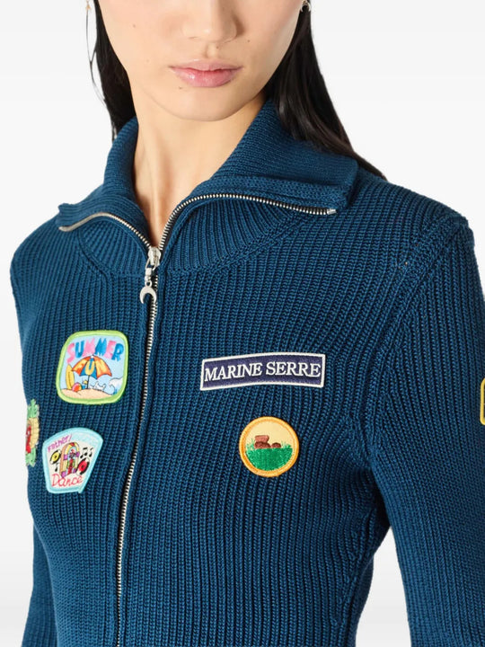 Blue jacket worn by a person, showing the jacket fit