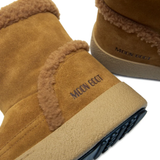 Close up of brown boot,showing texture of the goat skin sheep skin fabric.