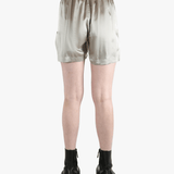 Grey shorts worn by a person, showing the shorts fit