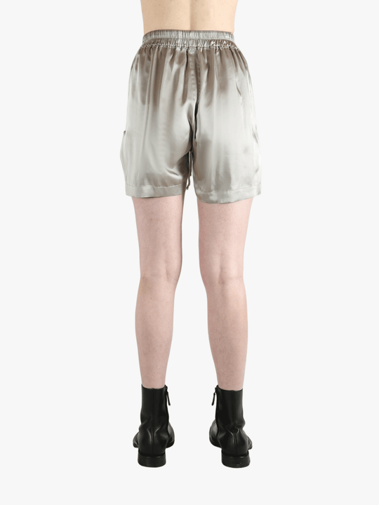 Grey shorts worn by a person, showing the shorts fit