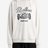 Tan hoodie worn by a person, showing the hoodie fit